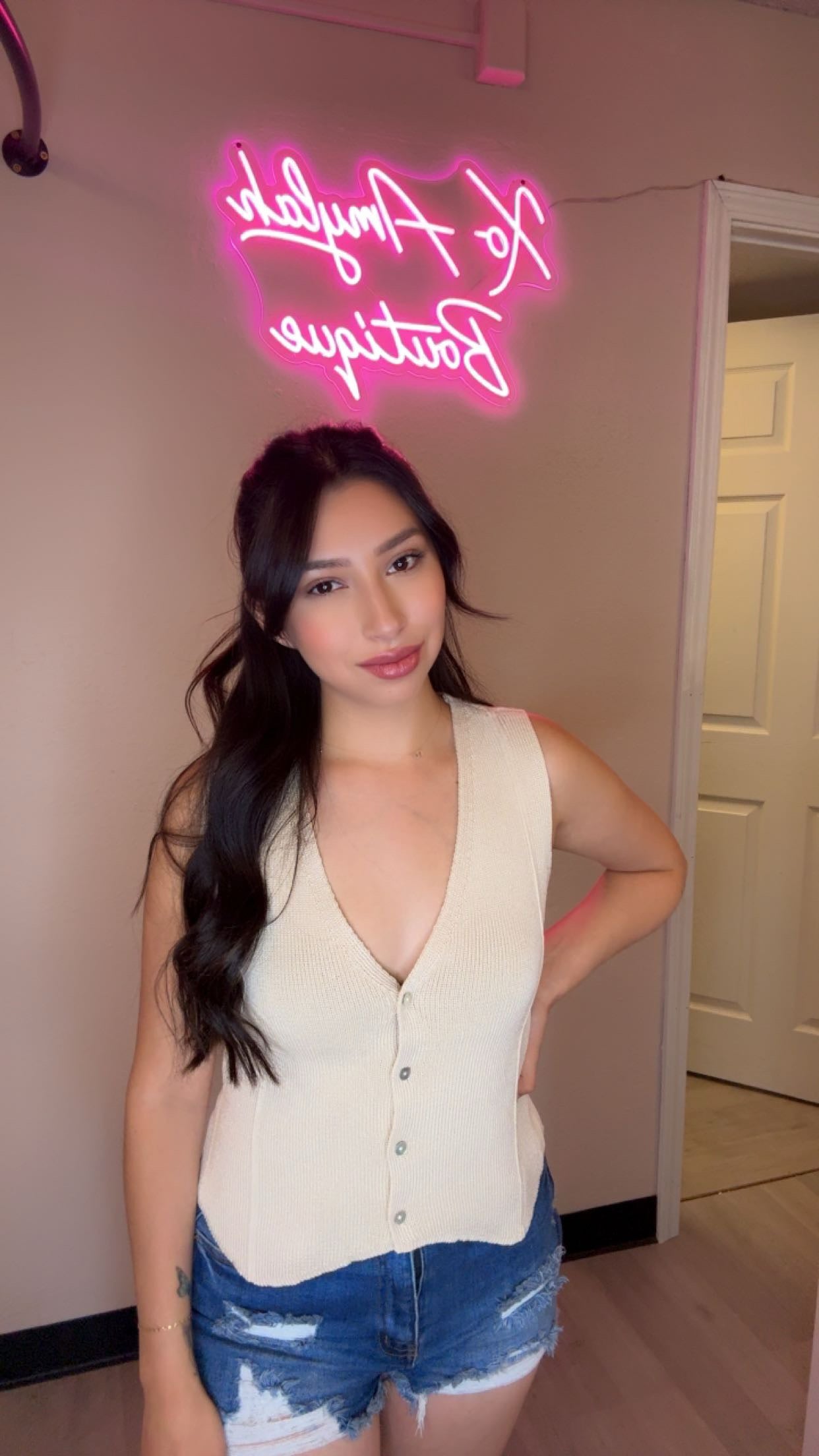 Knit sleeveless button down top